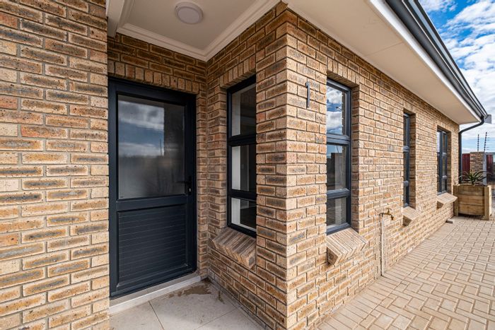 For Sale: Townhouse in C Place with off-grid living, garage, and security features.