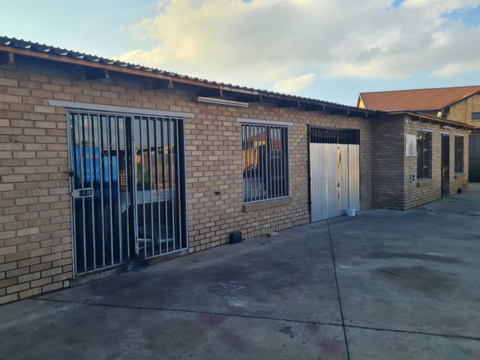 Commercial property to rent in Lenasia Ext 13 with large yard and carports.