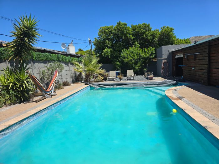 House for Sale in Milnerton Central: 3-4 bedrooms, pool, braai area, versatile layout.