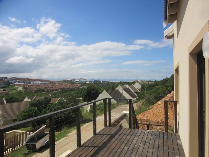 For Sale: House in Vakansieplaas with double garage, bachelor flat, and balconies.