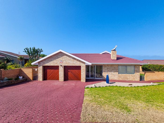 For Sale: House in Dana Bay with braai areas, security, and double garage.