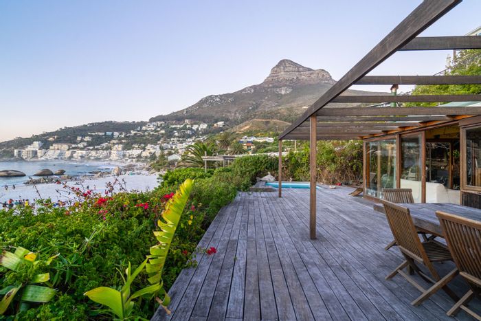 Beachfront house in Clifton for sale, offering ocean views and design potential.