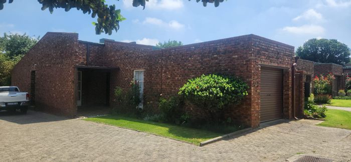 For Sale: 3-Bedroom Townhouse in Standerton Central with secure parking and outdoor space.