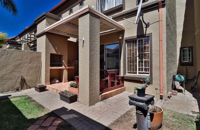 Townhouse For Sale in Eden Glen: 2 beds, private garden, pool, clubhouse amenities.