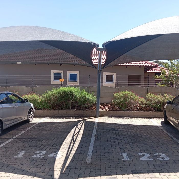 Spacious 3-bedroom apartment with secure estate access, front and back grass areas. To Rent in Benoni AH.