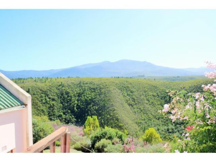 For Sale: Farm in The Crags with 2 cottages, garage, and mountain views.