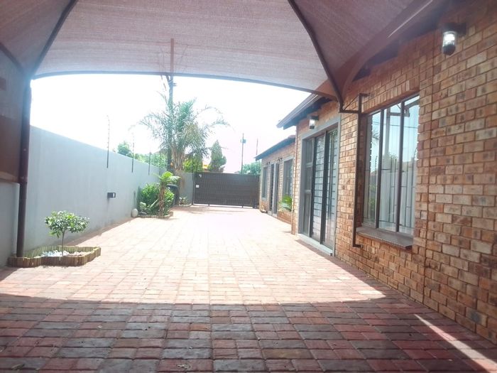 House To Rent in Protea Glen: 3 bedrooms, security features, bachelor rooms available.