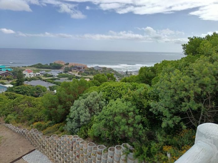 Elevated vacant land in Brenton On Sea, walking distance to the ocean, for sale.