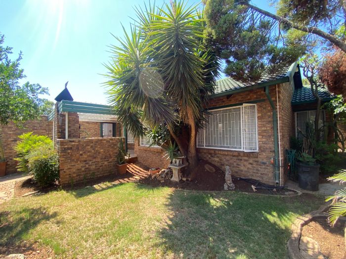 For Sale: Highveld House with fireplace, study, patio, and automated garages.