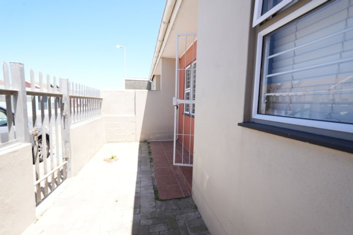 Two-bedroom house in Pelican Park with secure parking and spacious yard. For Sale.