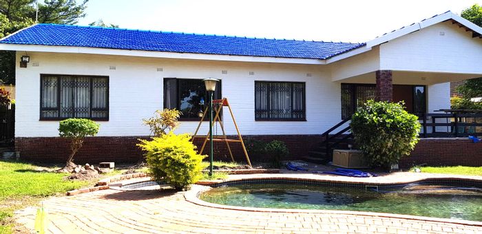 For Sale: Spacious 4-bedroom house in Scottburgh South with pool and garage.