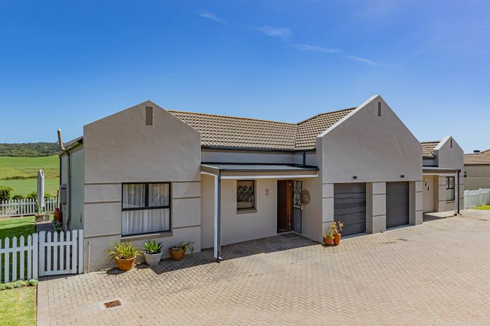 House for Sale in Reebok: Secure estate, indoor braai, garden, office nook.