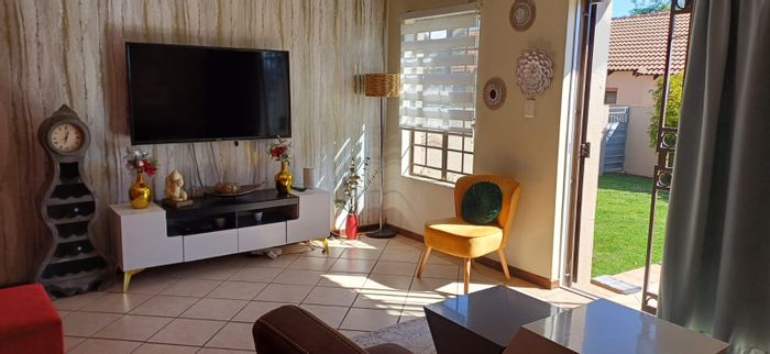 For Sale: Apartment in Mooikloof Ridge with private patio, double garage, and garden views.