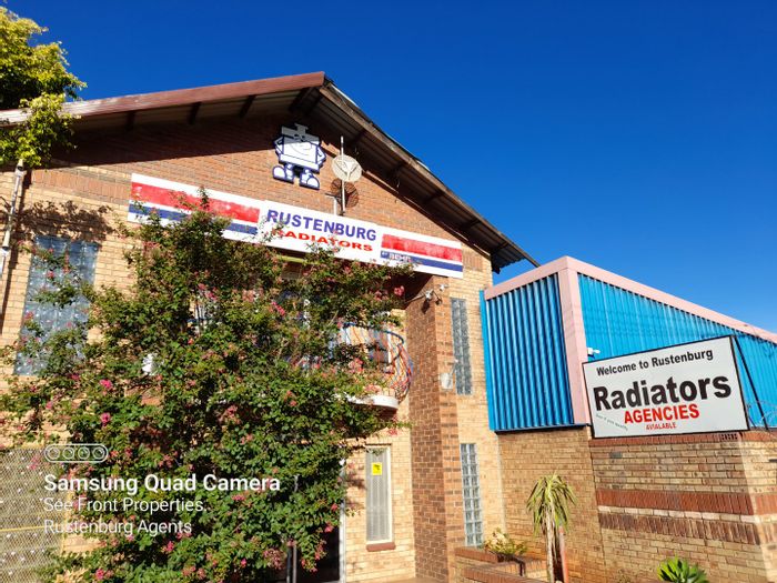 Industrial Property For Sale in Rustenburg Central: Workshop, offices, and ample parking.