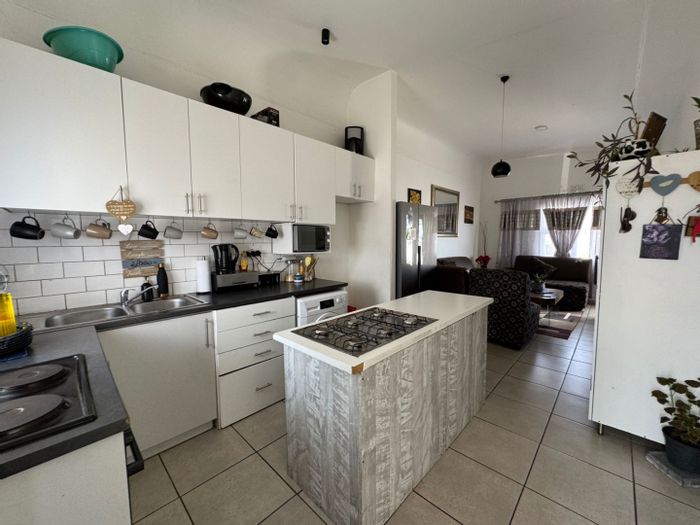 For Sale: House at The Conifers with 2 bedrooms, backyard, and open plan living.