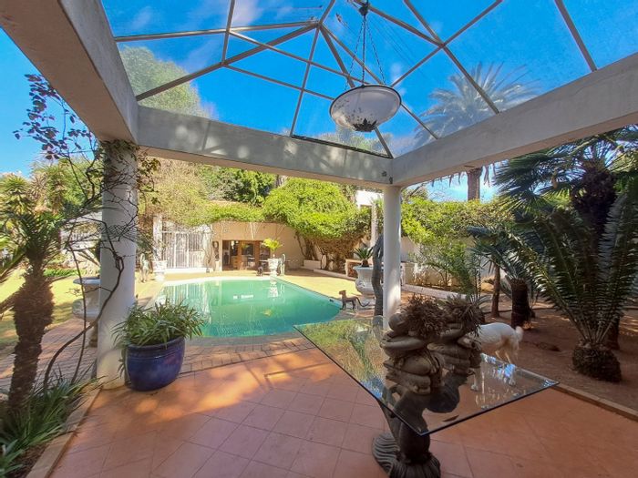 Saxonwold House For Sale: Pool, cottages, large garden, and garage for four cars.