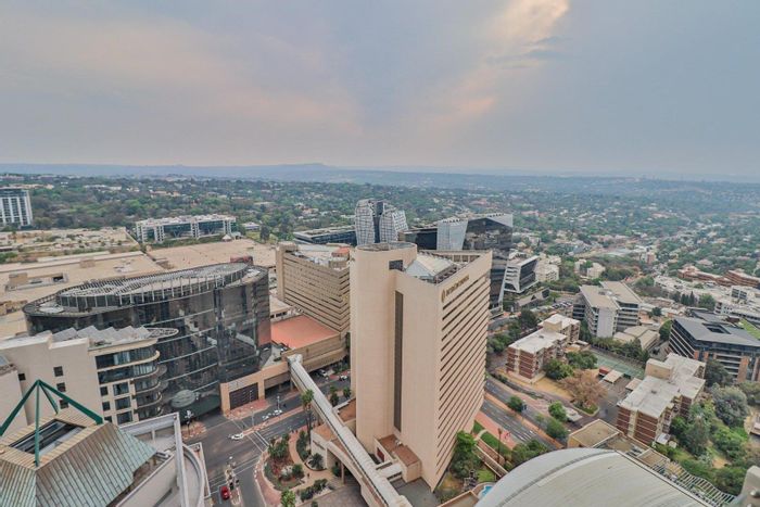 For Sale: Luxurious Sandown Apartment with private elevator, pool, and gym access.