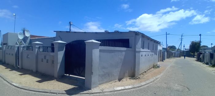 Two-bedroom house in Bloekombos with garage, storage, and enclosed yard for sale.