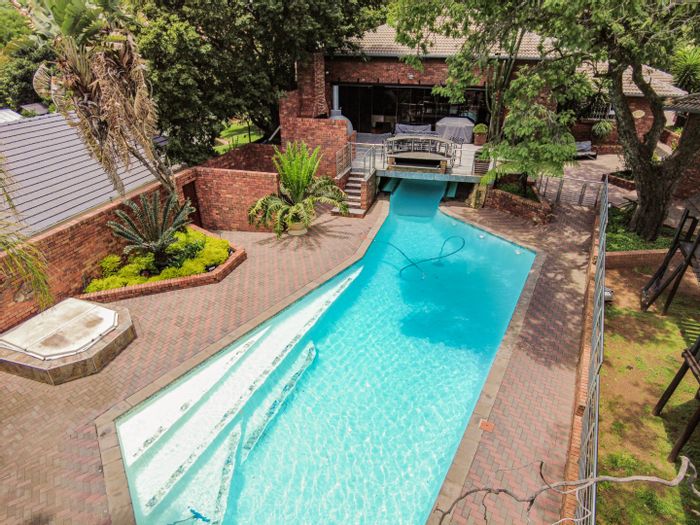 Bryanston House For Sale: 14 garages, gym, squash court, and expansive gardens.