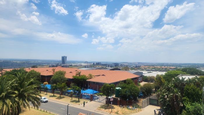For Sale: Commercial Property in Halfway Gardens with Offices, Security, and Parking.