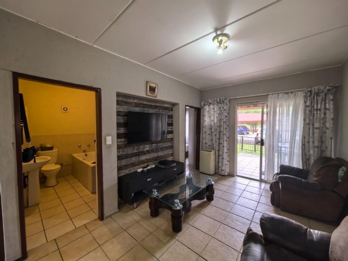 For Sale: 2-Bed, 2-Bath Apartment in Comet, Secure Estate Living with Private Patio.