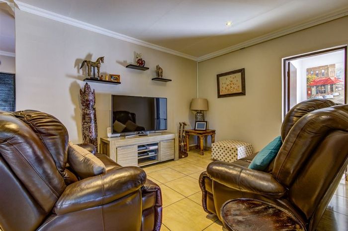 For Sale: Spacious 4-bedroom house in Parkrand with pool and ample parking.