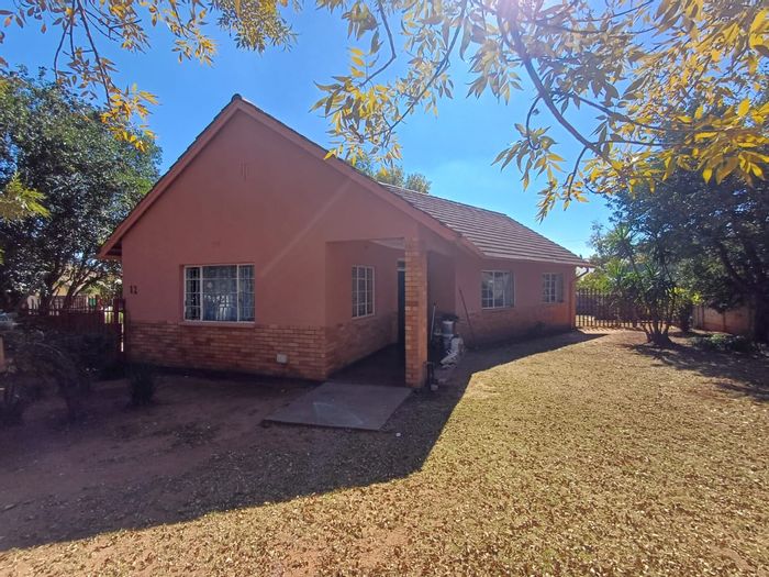 For Sale: House in Stilfontein Central with 3 bedrooms, garage, and extra room.