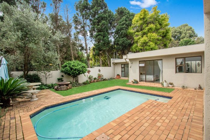 For Sale: Paulshof Townhouse with private garden, pool, study, and 24/7 security.