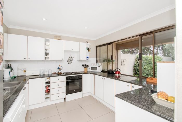 For Sale: Paulshof Townhouse with private garden, pool, study, and 24/7 security.