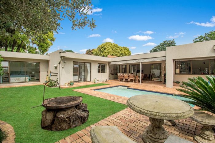 For Sale: Paulshof Townhouse with private garden, pool, study, and 24/7 security.