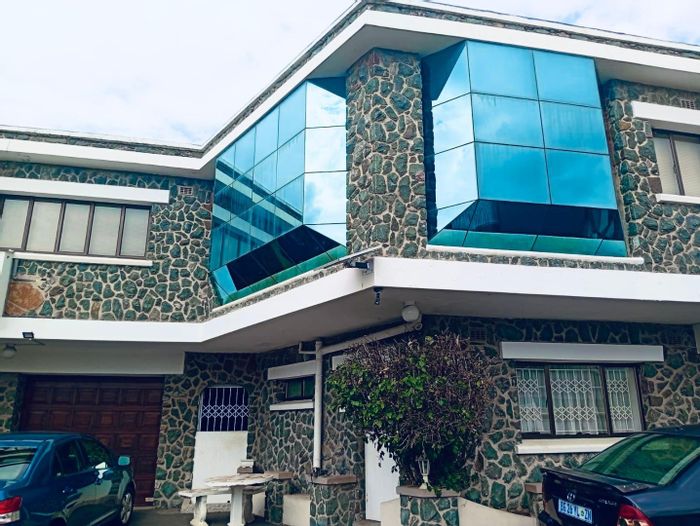 For Sale: Spacious 5-bedroom house in Reservoir Hills with multiple living areas and garages.