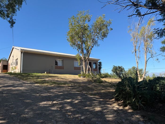 House For Sale in Van Wyksdorp: Spacious yard, garage, and scenic views.