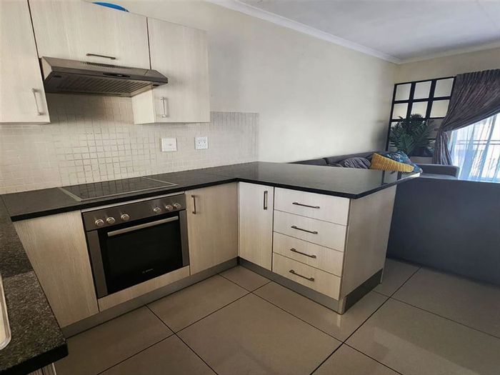 2-Bedroom Apartment in Pomona For Sale: Low-maintenance living with covered carport.
