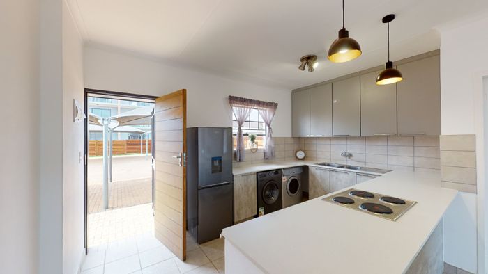 3-Bedroom Apartment For Sale in Monavoni with Private Garden and Security Features.