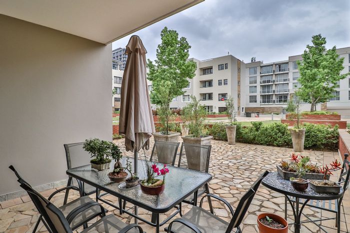 For Sale: Apartment in Bedford Gardens with garden patio, 2 bedrooms, secure parking.