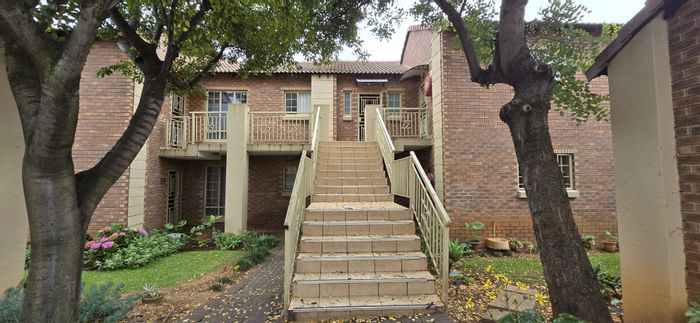 2-Bedroom Apartment For Sale in Mooikloof Ridge with garage, pool, and tennis court.