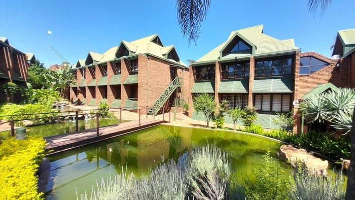 Wapadrand Commercial Suite For Sale: Versatile layout, parking, and tranquil outdoor space.