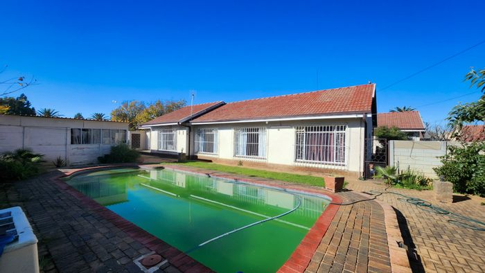 Spacious Meiringspark house with flatlet, garages, borehole, and pool for sale.