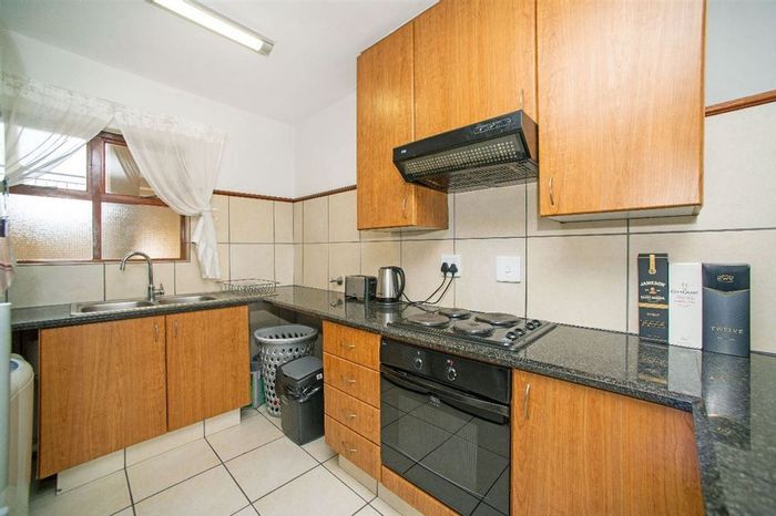 Rynfield Townhouse For Sale: 2 Bedrooms, spacious lounge, secure parking, convenient layout.
