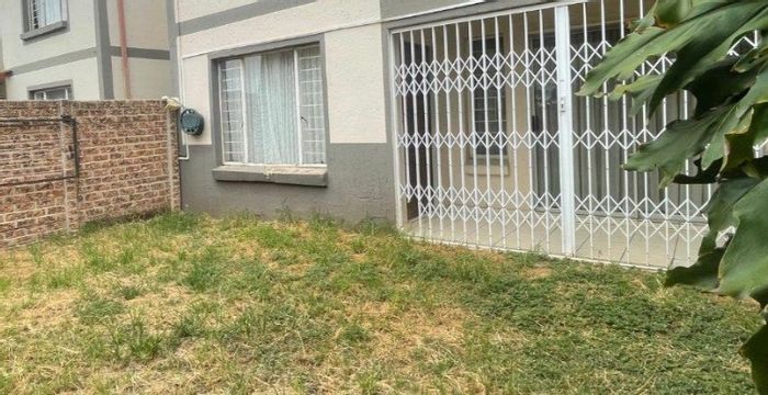 For Sale: 2-Bedroom Apartment in Parkrand with garden, security, and parking.