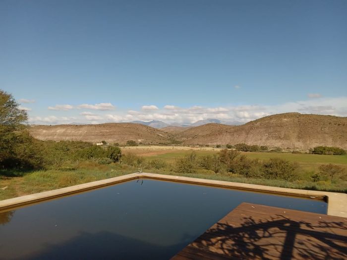Farm for Sale in Van Wyksdorp: Natural pool, olive orchards, solar energy, versatile loft.