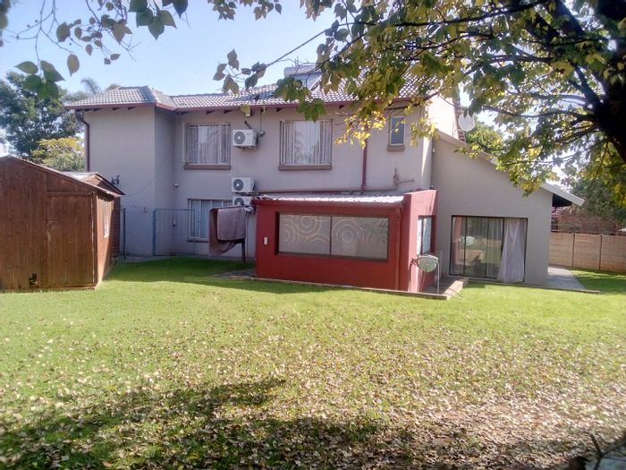 For Sale: Rooihuiskraal North House with 5 bedrooms, large yard, and double garage.