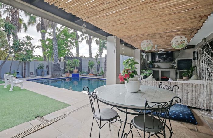 For Sale: House in West Beach with pool, garden, and versatile living spaces.