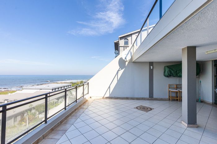 For Sale: Uvongo Apartment with sea views, large balcony, and spacious living areas.