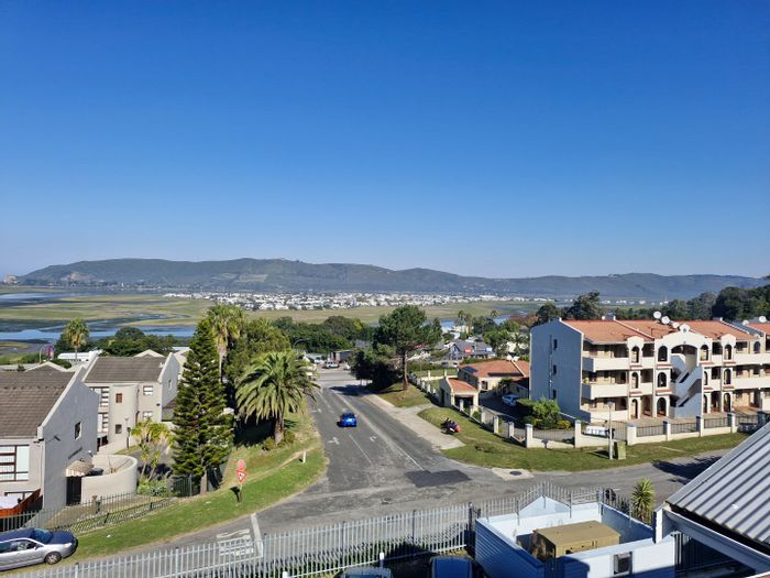 Spacious 1-bedroom apartment in Old Place, For Sale with rooftop views and amenities.