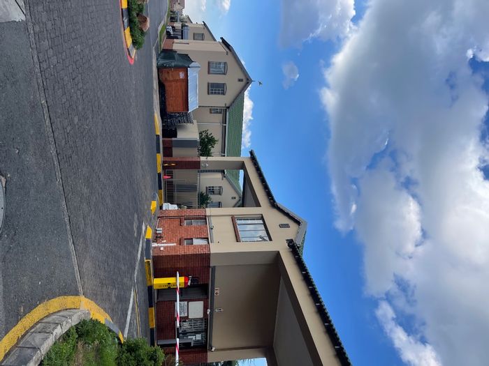 2-Bedroom Apartment For Sale in Kempton Park AH with Security, Parking, and Amenities.