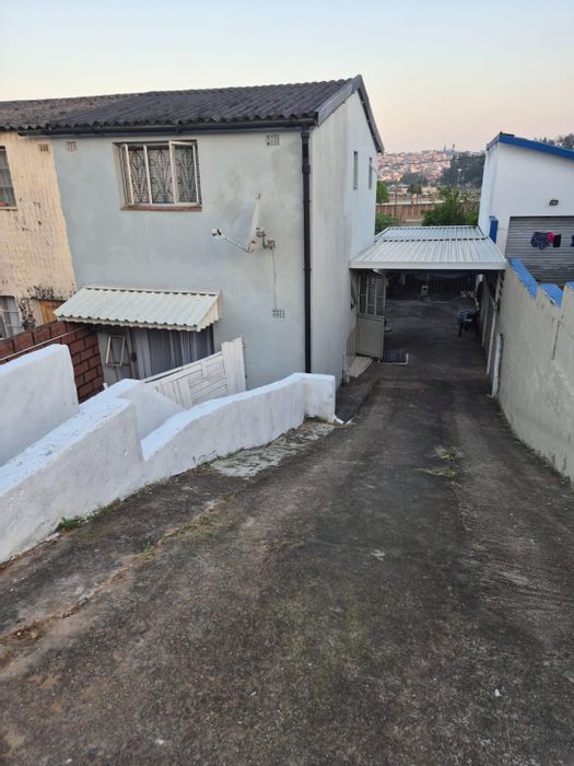 2-Bedroom House For Sale in Wentworth with backyard, braai area, and garage.