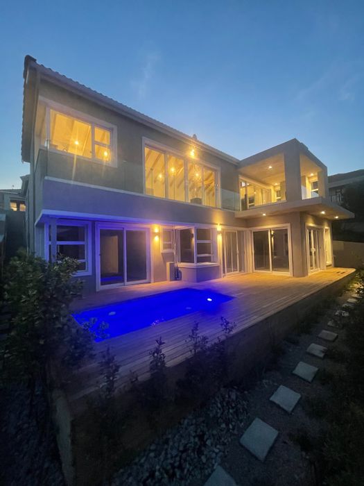 For Sale: House in Whale Rock Heights with pool, eco-friendly features, and entertainment patio.