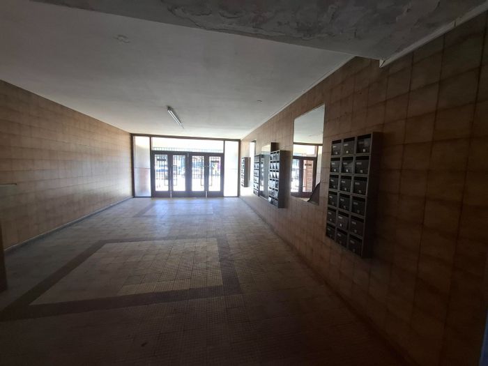 For Sale: Apartment in Pretoria Central with tiled lounge, ample storage, and transport access.