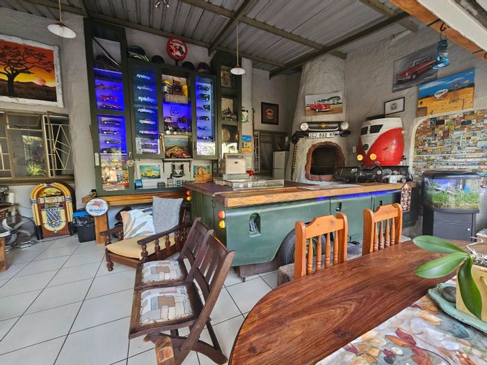 For Sale: House in Kingsview Ext 1 with koi pond, 8 carports, and log cabin.